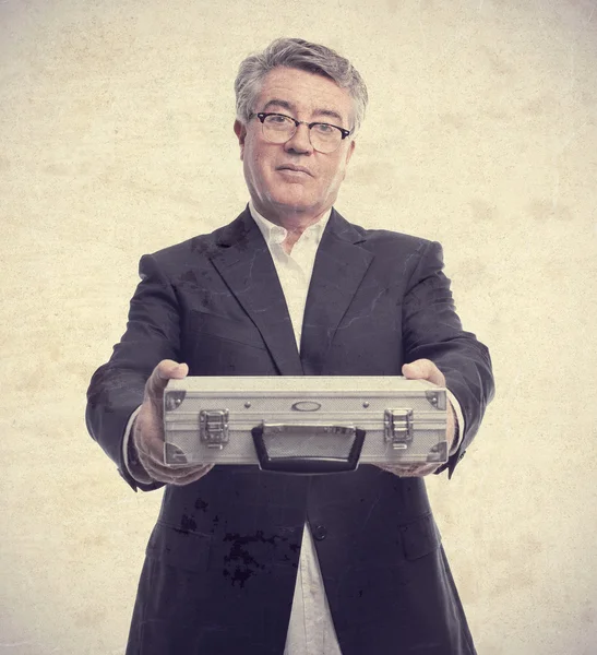 Senior cool man with a steel briefcase — Stock Photo, Image