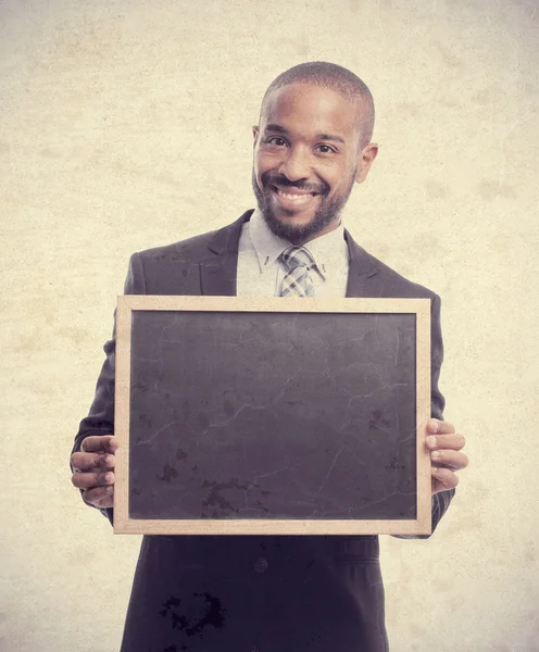 Joven fresco negro hombre con una pizarra — Foto de Stock