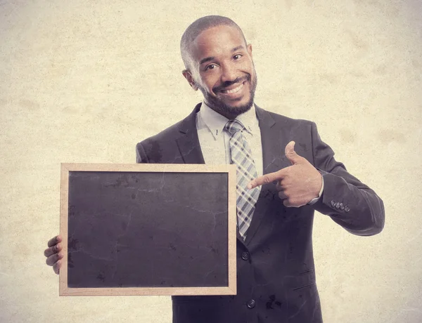 Young cool black man with a blackboard — Stock Photo, Image