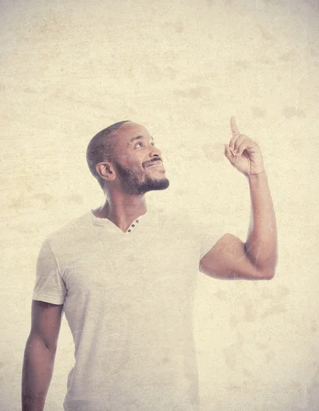 Young cool black man pointing up — Stock Photo, Image