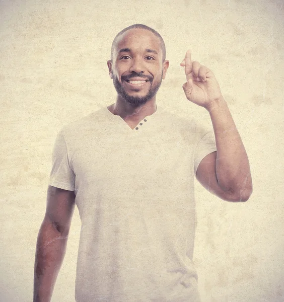 Young cool black man finger crossing — Stock Photo, Image