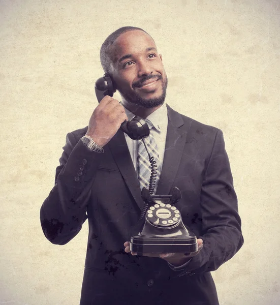 Young cool black man speaking at telephone — Stock Photo, Image