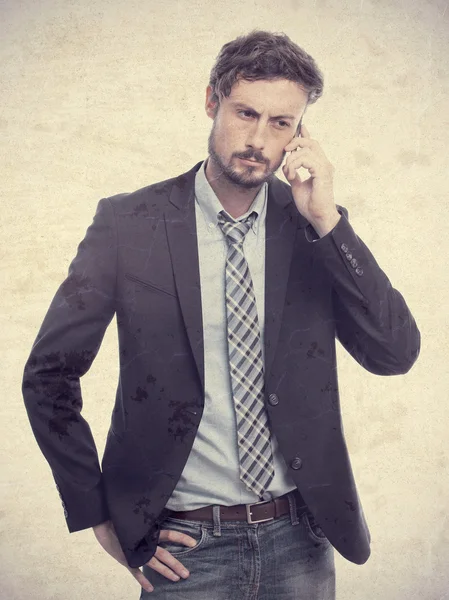 Young crazy businessman speaking on phone — Stock Photo, Image