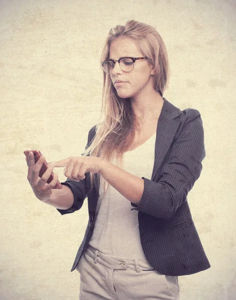 Young cool woman with touch screen phone — Stock Photo, Image