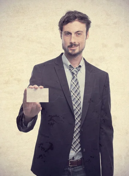 Молодой сумасшедший бизнесмен с именной карточкой — стоковое фото