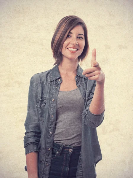 Young cool woman pointing — Stock Photo, Image