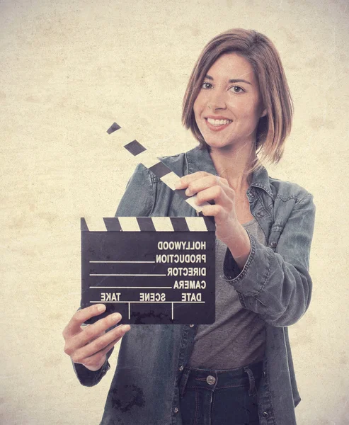 Young cool woman with a clapperboard — Stock Photo, Image