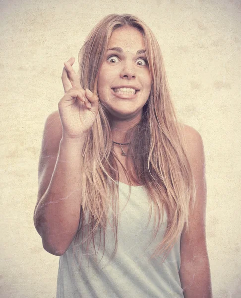 Young cool woman finger crossing — Stock Photo, Image