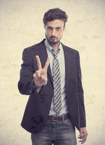 Young crazy businessman victory gesture — Stock Photo, Image