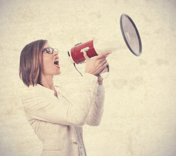 Young cool woman with a megaphone — Stock Photo, Image