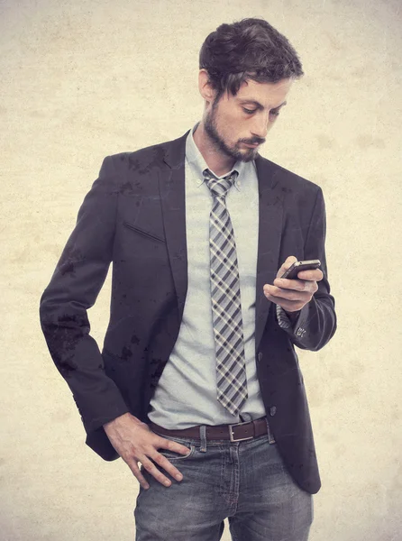 Young crazy businessman wrinting on phone — Stock Photo, Image