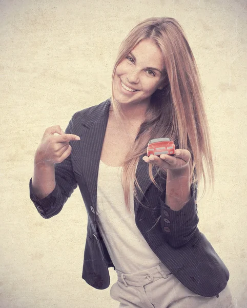 Young cool woman with car toy — Stock Photo, Image