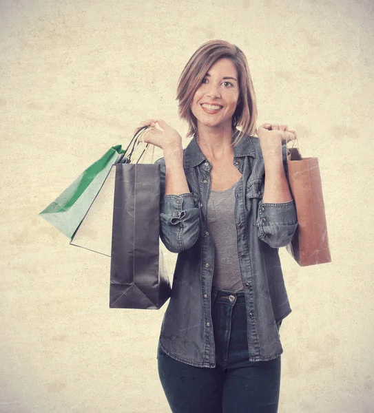 Jovem mulher legal com sacos de compras — Fotografia de Stock