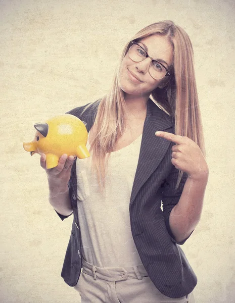 Young cool woman with a piggy bank — Stock Photo, Image