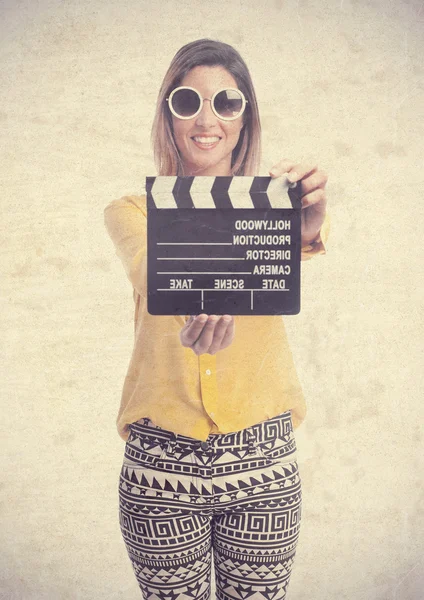Young cool woman with clapperboard — Stock Photo, Image