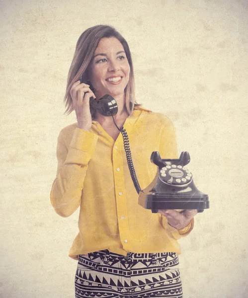 Young cool woman with a telephone — Stock Photo, Image