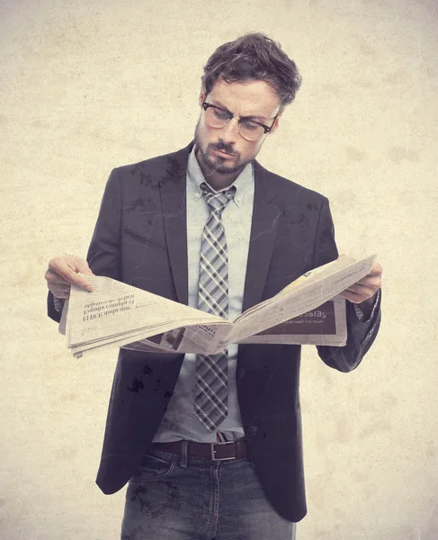 Young crazy businessman with a newspaper — Stock Photo, Image