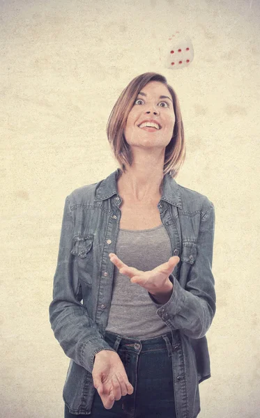 Young cool woman with a dice — Stock Photo, Image