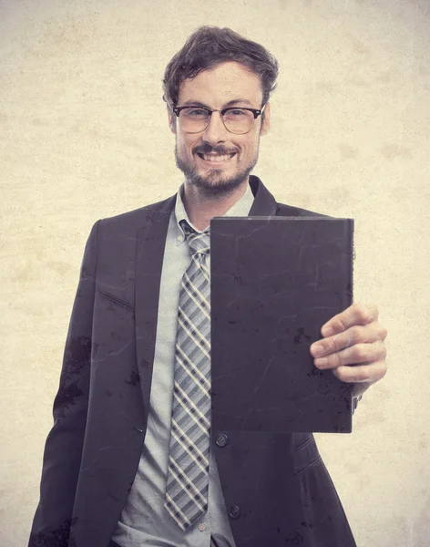 Junger verrückter Geschäftsmann mit einem Buch — Stockfoto