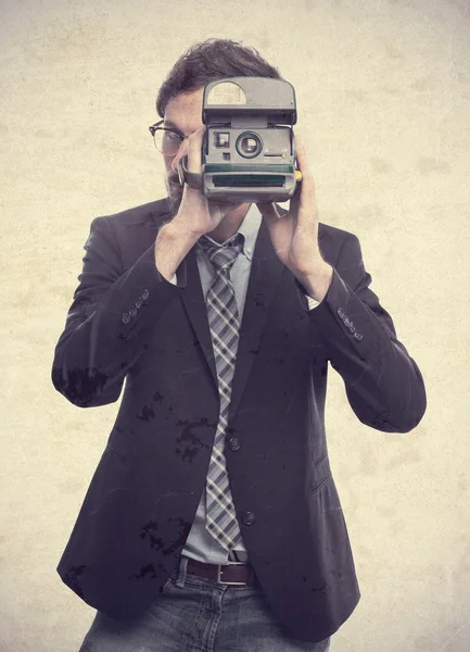 Joven loco hombre de negocios tomando una foto —  Fotos de Stock