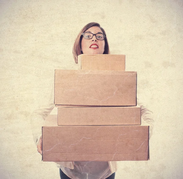 Young cool woman with boxes — Stock Photo, Image