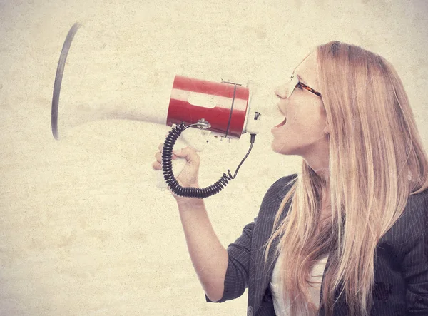 Young cool woman with a megaphone — Stock Photo, Image