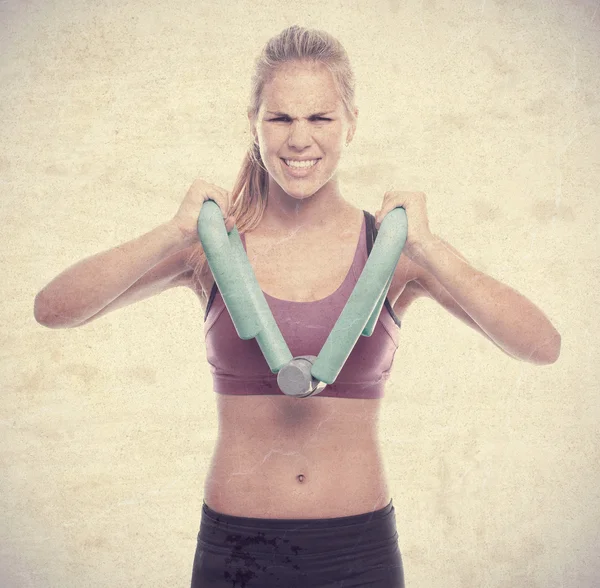 Young cool woman with a dumbbell — Stock Photo, Image