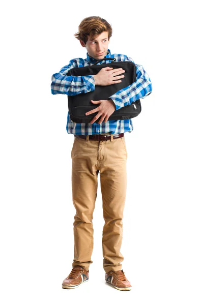 Teenager holding a suitecase — Stock Photo, Image