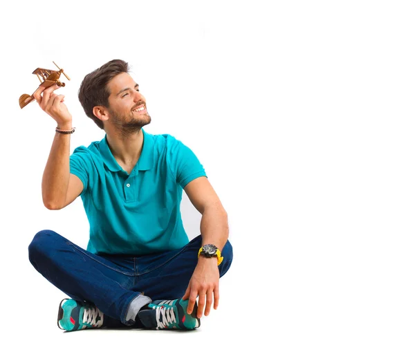 Chico jugando con avión de madera — Foto de Stock