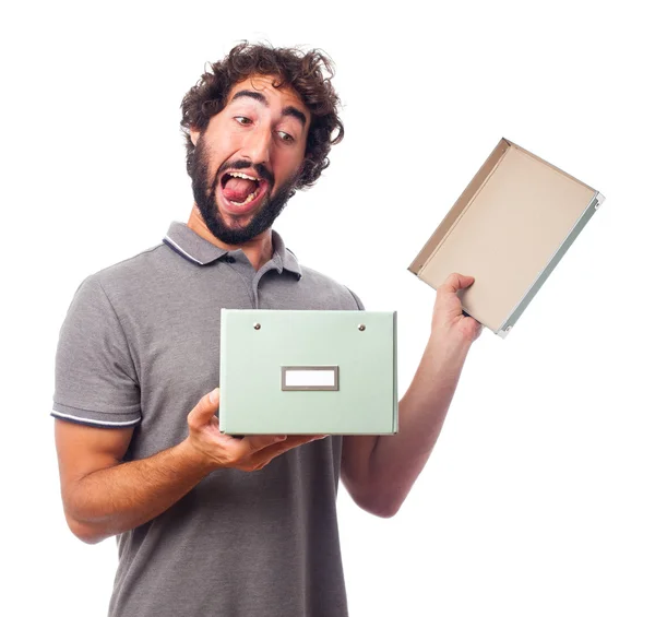 Young crazy man opening a box — Stock Photo, Image