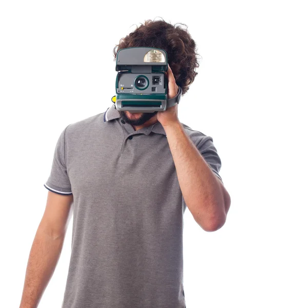 Young crazy man with a photo camera instant — Stock Photo, Image