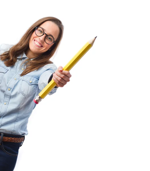 Young woman holding a pencil — Stock Photo, Image