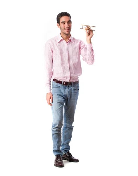 Guy playing with wooden plane — Stock Photo, Image