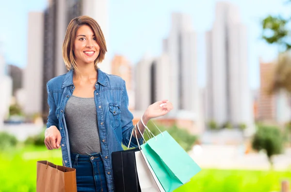 Joven mujer cool con bolsas de compras —  Fotos de Stock