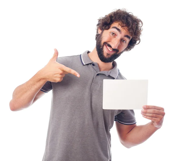 Jovem louco apontando com um cartaz — Fotografia de Stock