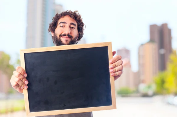 Junger verrückter Mann zeigt eine Tafel — Stockfoto