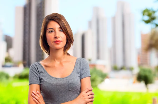 Young cool woman crossed arms and confidence — Stock Photo, Image