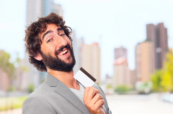 Young crazy man with a credit card — Stock Photo, Image