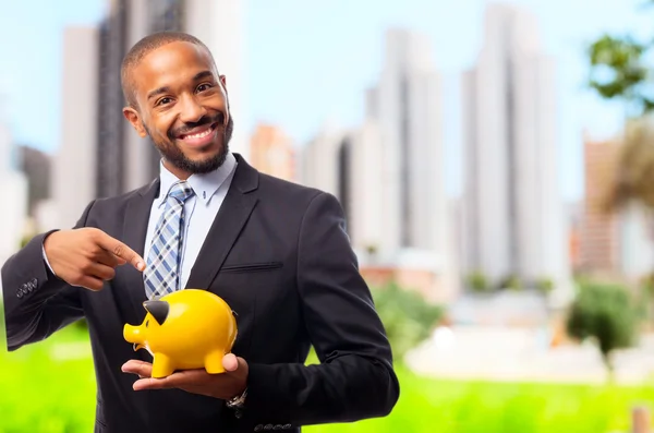 Young cool black man pointing savings — Stock Photo, Image