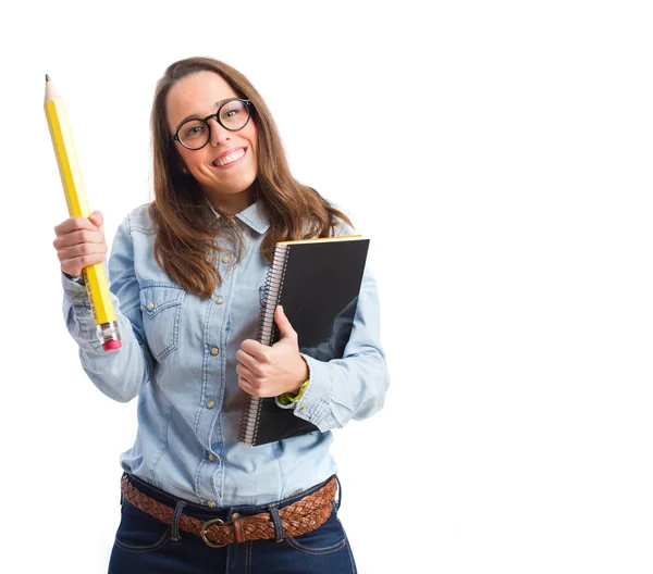 Young woman with pencil holding a notebook — Stock Photo, Image