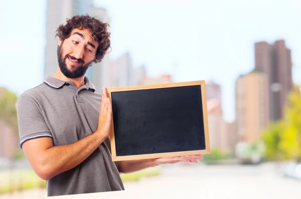 Young crazy man with a blackboard — Stock Photo, Image