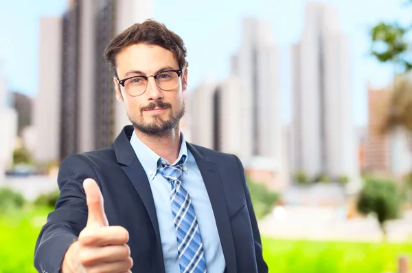 Young crazy businessman all right gesture — Stock Photo, Image