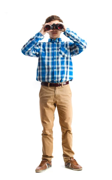 Teenager looking for a binoculars — Stock Photo, Image