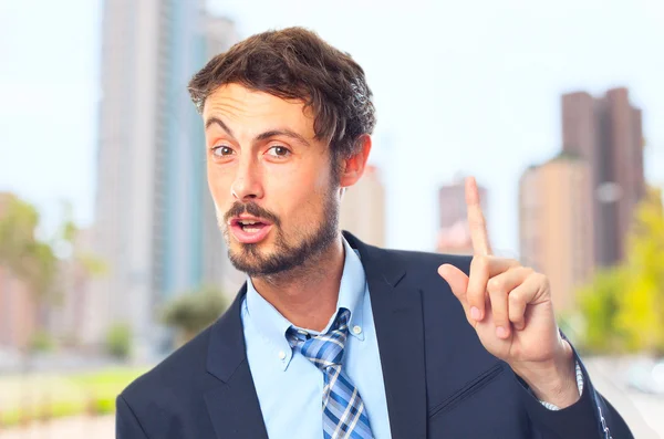 Young crazy businessman having an idea — Stock Photo, Image