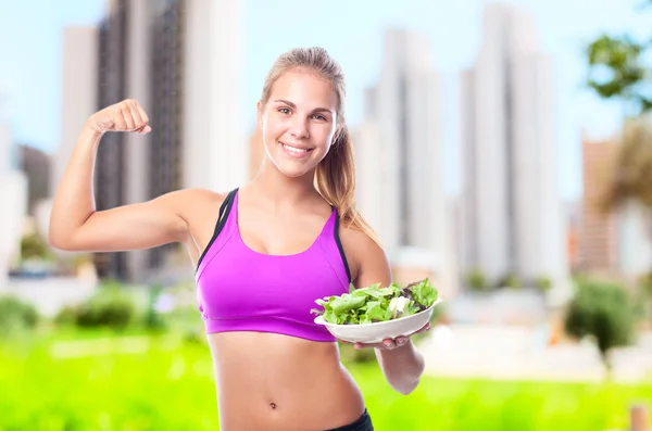 Young cool woman with a salad — Stock Photo, Image