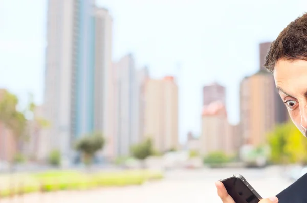 Young crazy businessman shouting on phone — Stock Photo, Image