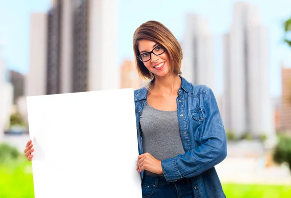 Young cool woman with a placard — Stock Photo, Image