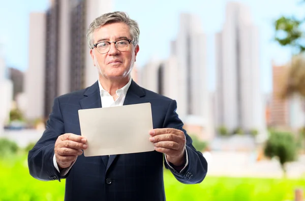 Senior cool man with a placard — Stock Photo, Image