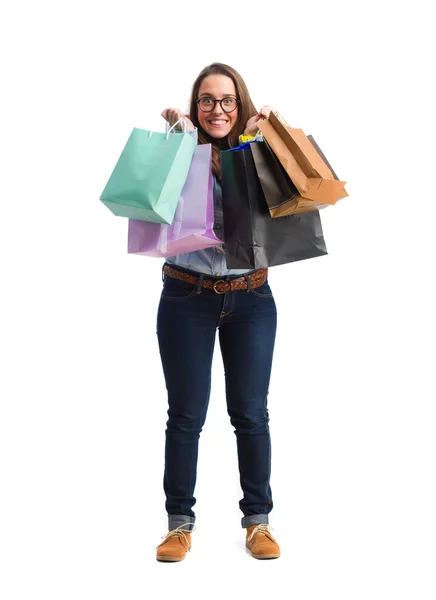 Młoda kobieta trzymając torby na zakupy — Zdjęcie stockowe
