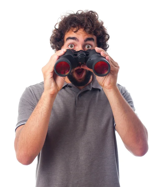 Young bearded man with binoculars — Stock Photo, Image